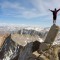 man-standing-on-edge-of-cliff