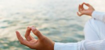 Woman practicing yoga at sunrise