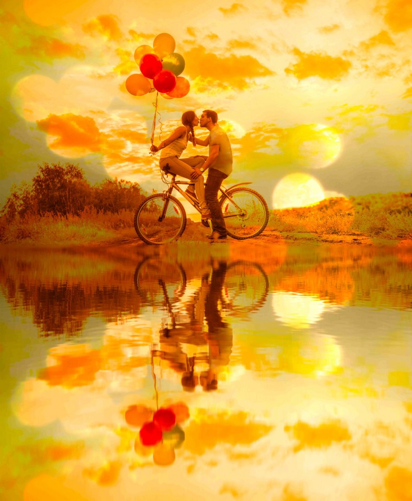 Silhouette of two people Young couple sitting  one bicycle